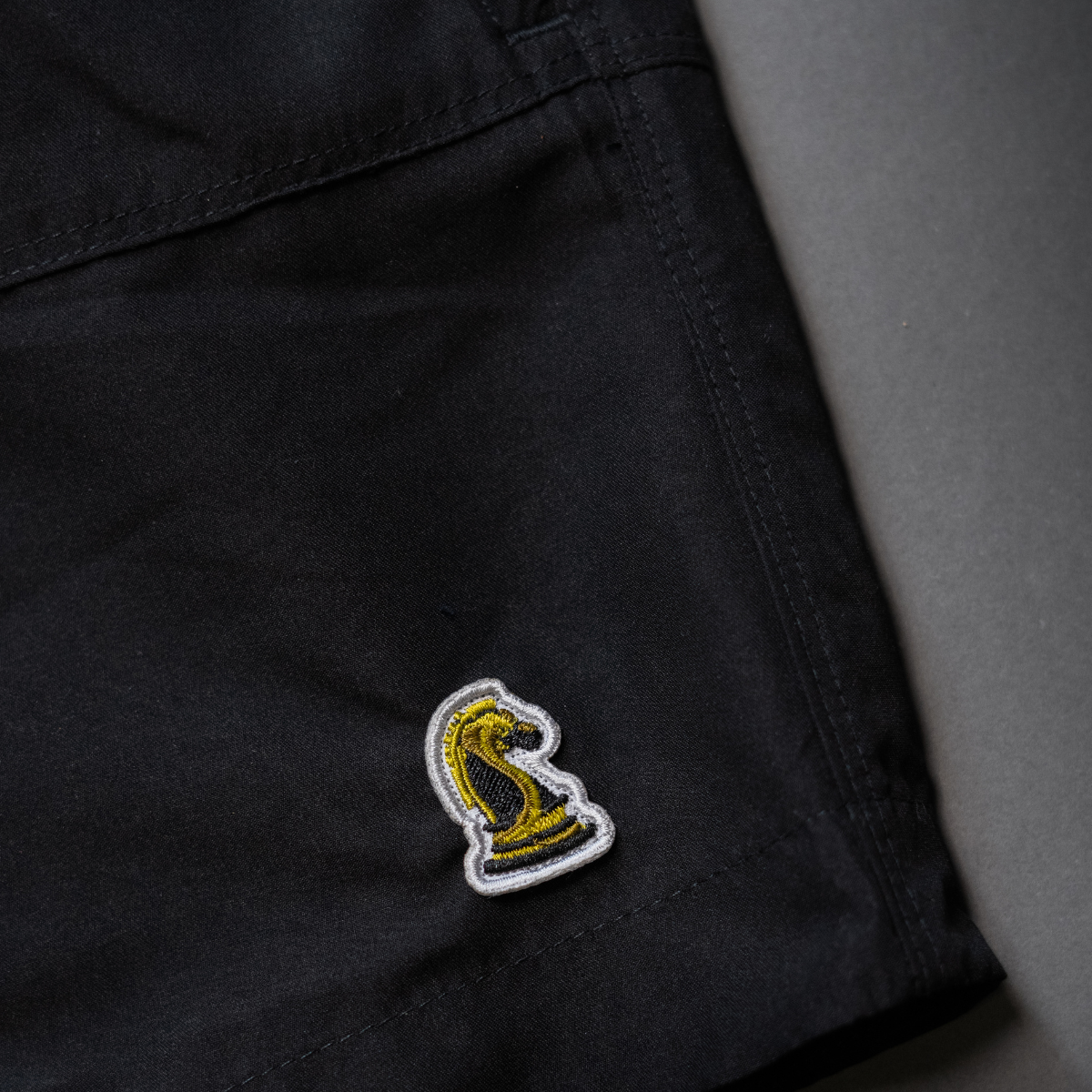 Black Shorts on Backdrop closeup